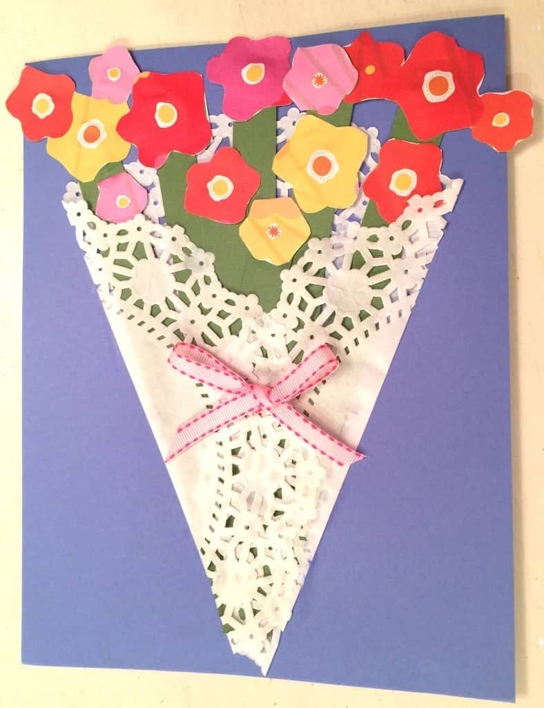 Make this very easy Mother's Day Paper Flower Craft! All you need is a dolie, craft paper, white glue, scissors and ribbon.