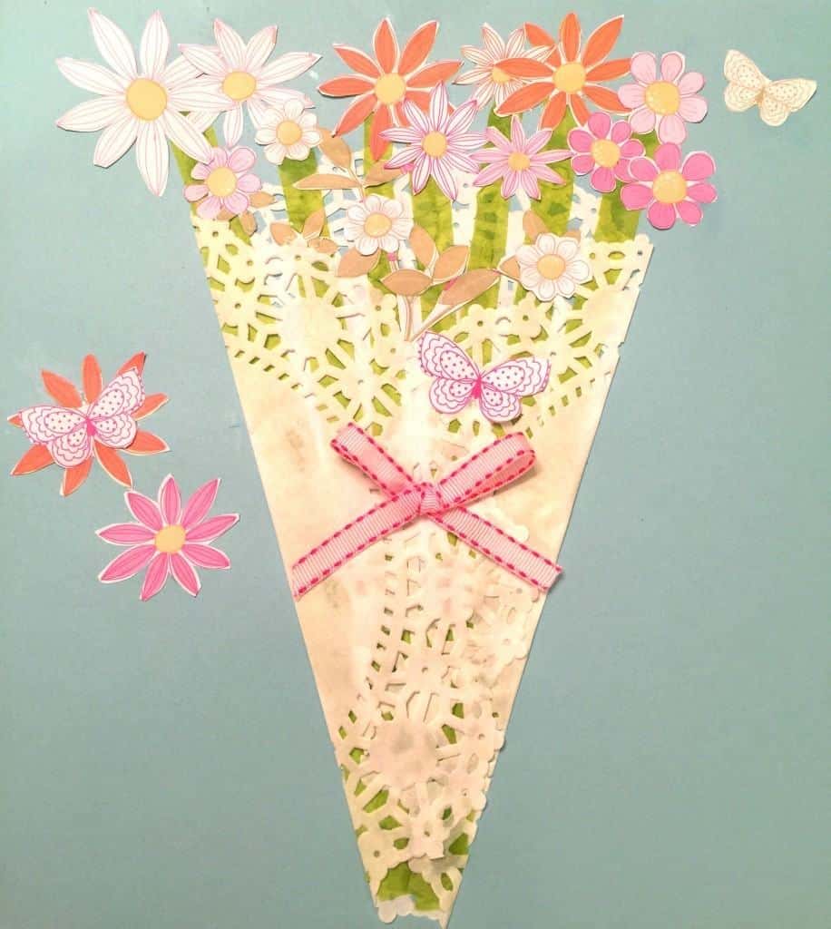 Make this very easy Mother's Day Paper Flower Craft! All you need is a dolie, craft paper, white glue, scissors and ribbon.