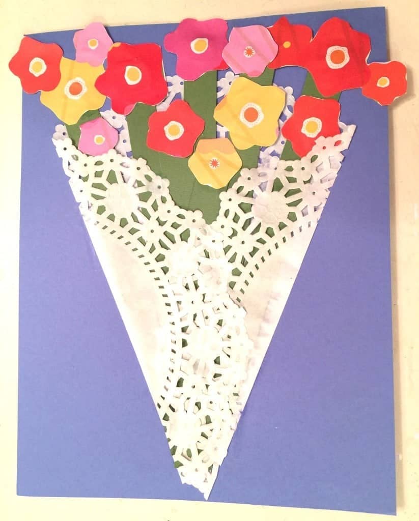 Make this very easy Mother's Day Paper Flower Craft! All you need is a dolie, craft paper, white glue, scissors and ribbon.