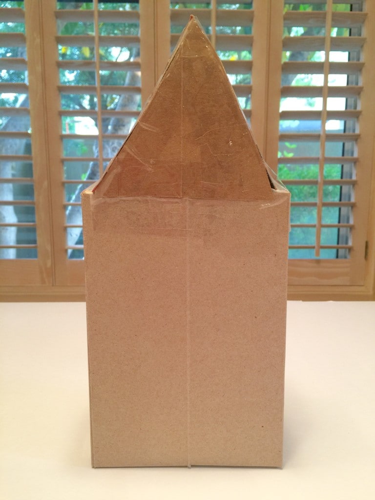 How to make a Homemade Gingerbread House out of cardboard and simple craft supplies.