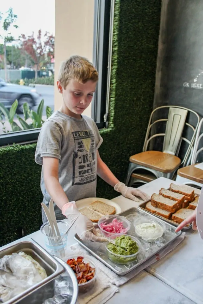 Are you looking for a family friendly restaurant in Orange County? Visit the newest kid friendly Mendocino Farms location in Irvine where kids can play bean bag toss, foosball and participate in free arts & crafts. Families can dine and have good conversation together in a living room type setting.