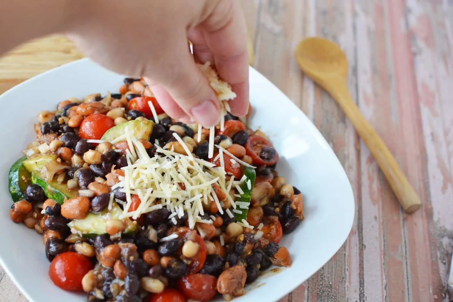 Are you planning a game day or super bowl party? This Easy Cold Bean Salad has the taste of 'mush' beans along with the crunch of an onion and a cucumber.  It also has a balsamic-y taste because of the vinegar, but it's not too strong.