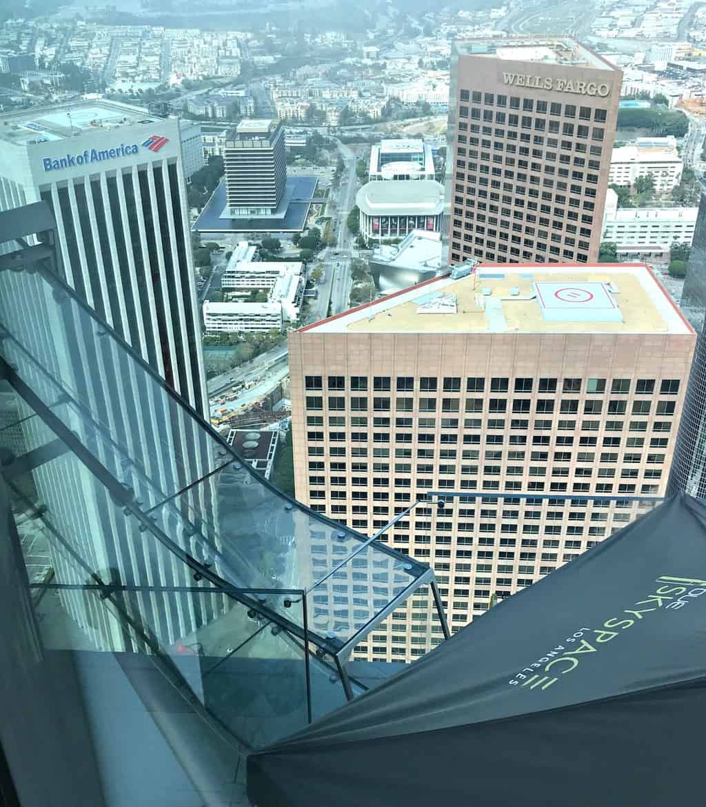 Are you an adventurous person looking for a fun time in Los Angeles?  If so, you should take a ride down the glass slide at Skyspace LA, the tallest open-air observation deck in California.  OUE Skyspace LA is a one-of-a-kind slide that goes along the outside of the iconic U.S. Bank Tower.  It's located approximately 73 stories tall and 1,000 feet above the ground.
