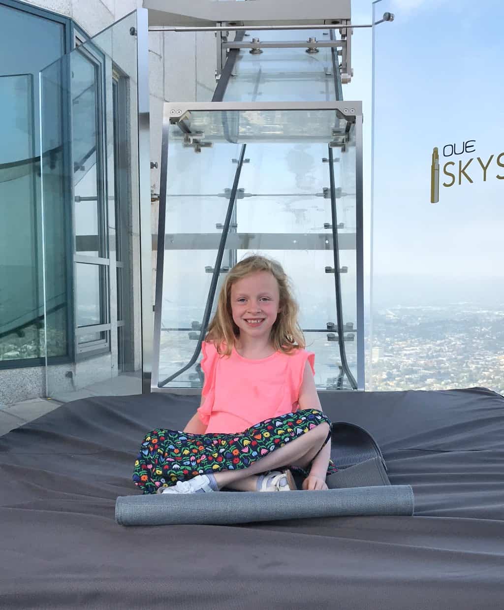Are you an adventurous person looking for a fun time in Los Angeles?  If so, you should take a ride down the glass slide at Skyspace LA, the tallest open-air observation deck in California.  OUE Skyspace LA is a one-of-a-kind slide that goes along the outside of the iconic U.S. Bank Tower.  It's located approximately 73 stories tall and 1,000 feet above the ground.