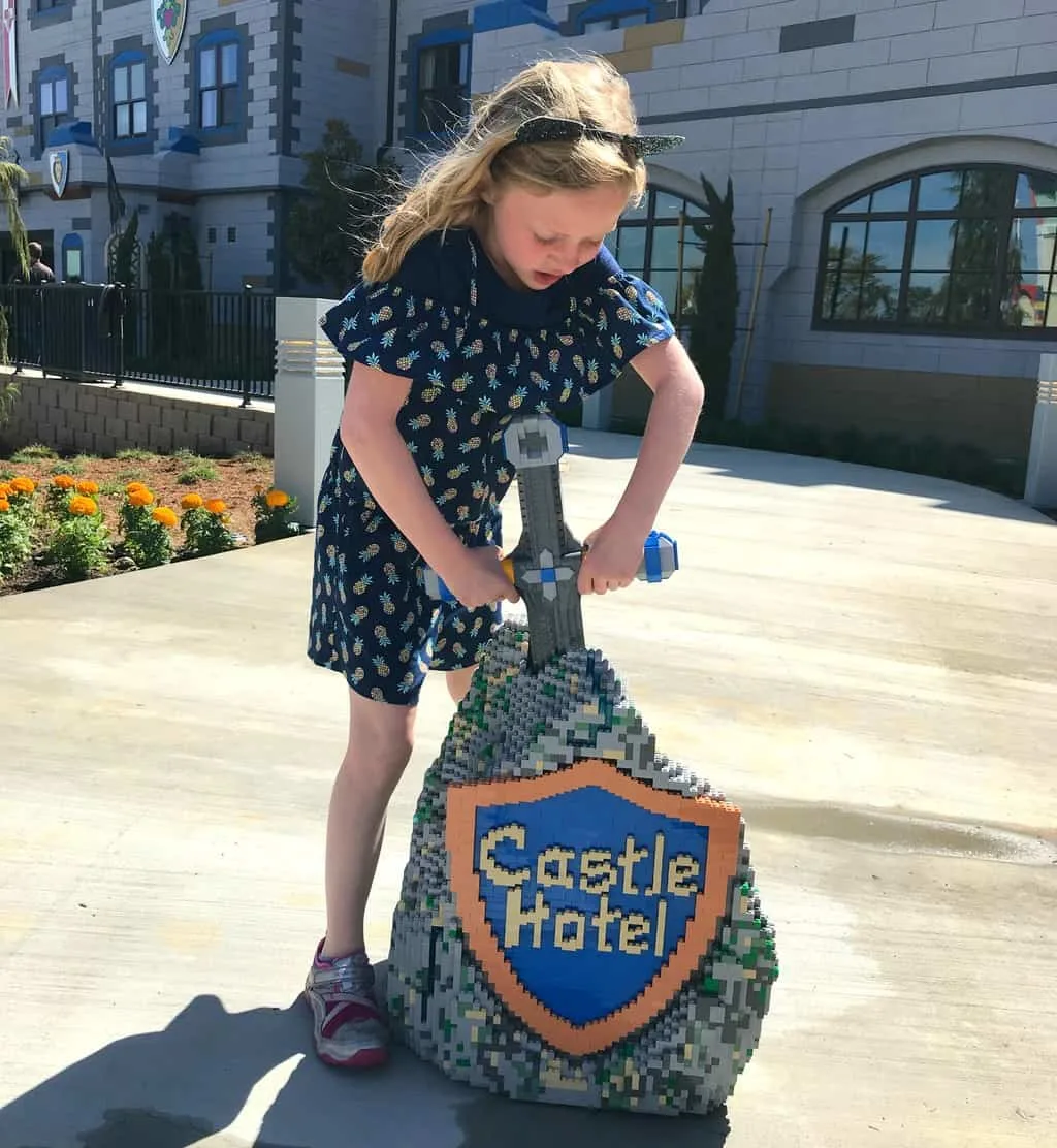 Girl standing in front of LEGOLAND Castle Hotel California