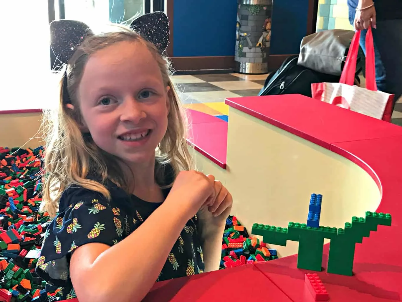 Girl playing with legos at LEGOLAND Castle Hotel
