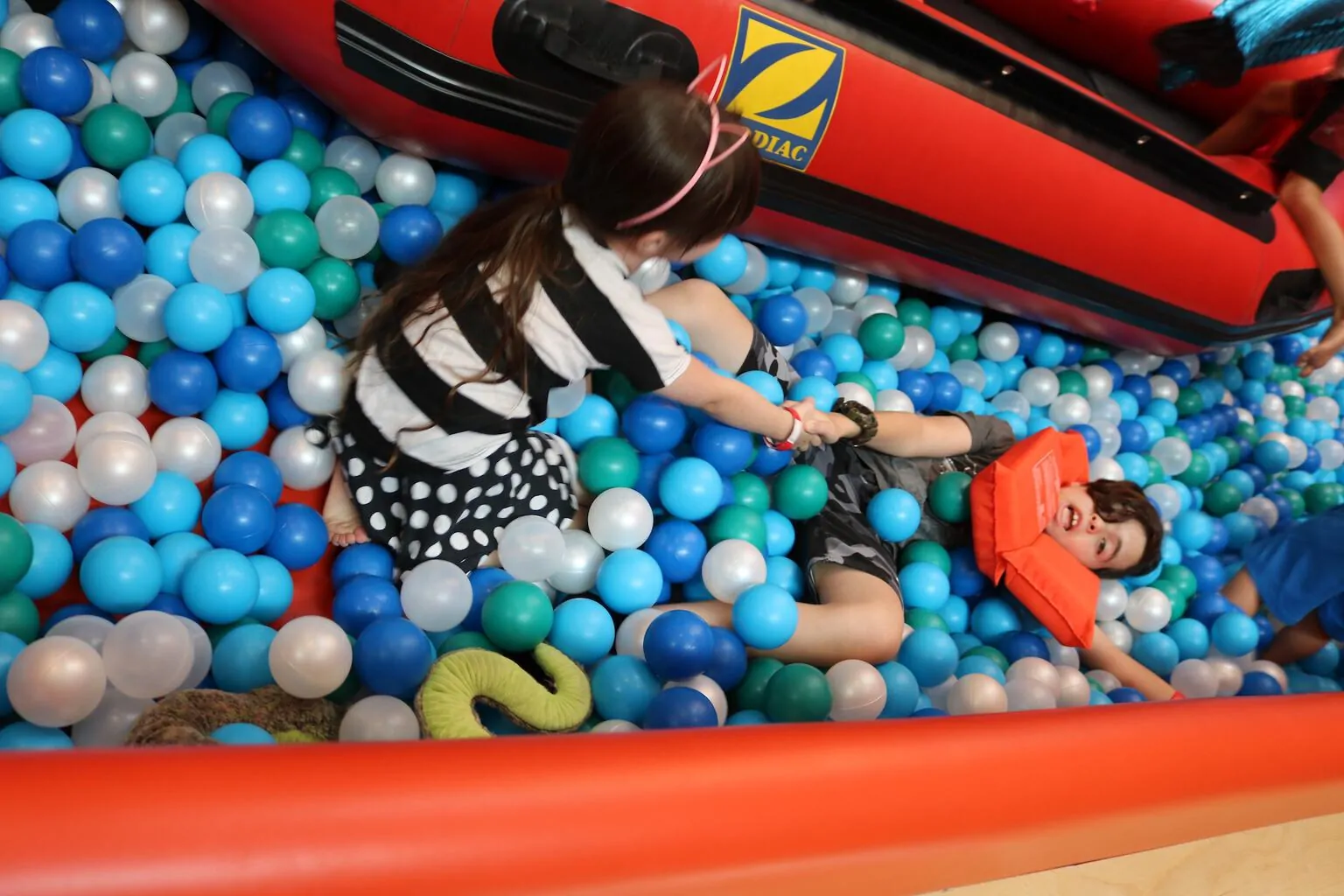 Girl and boy in ball pit at Cayton Children's Museum in Santa Monica